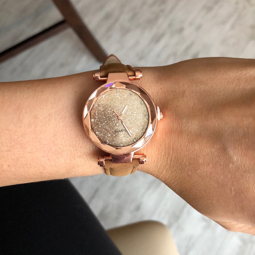 Camel colored watch with rose gold face